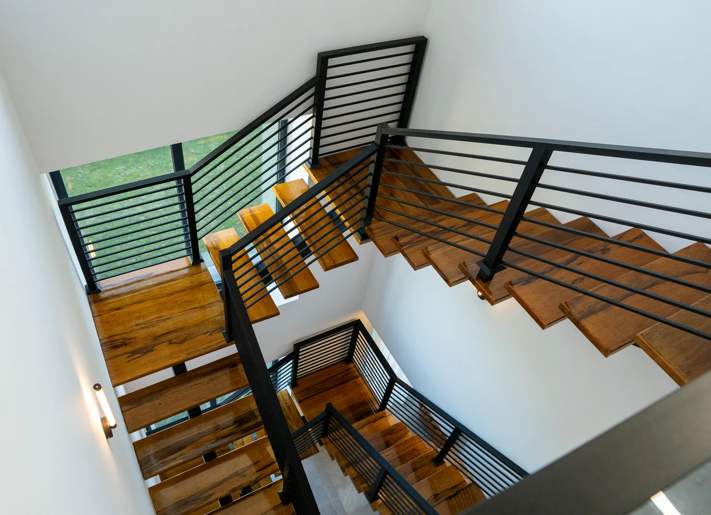 Custom floating stair installation in a Nassau County colonial home